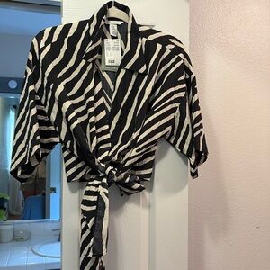 H&M crop top. You can dress it up or dress it down. Ties in the front.